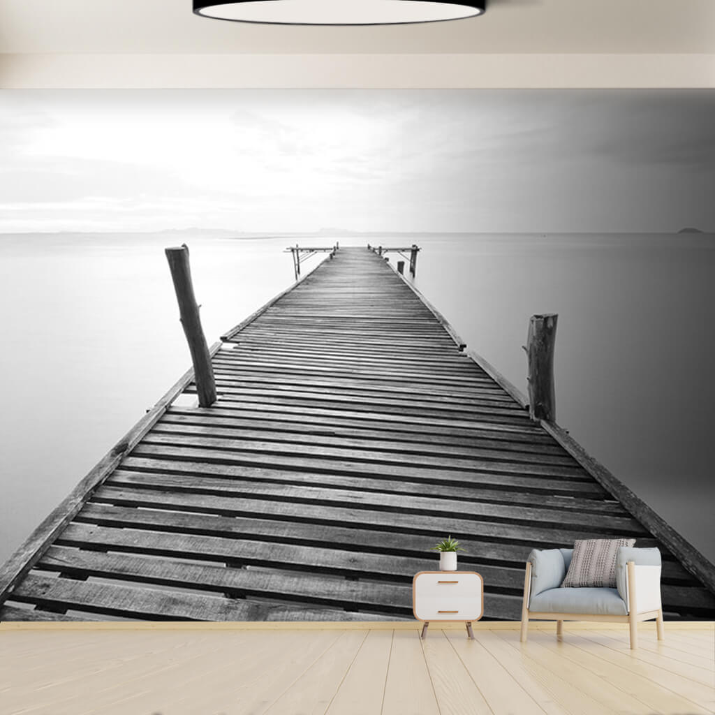 Pier extending into the sea black and white wall mural