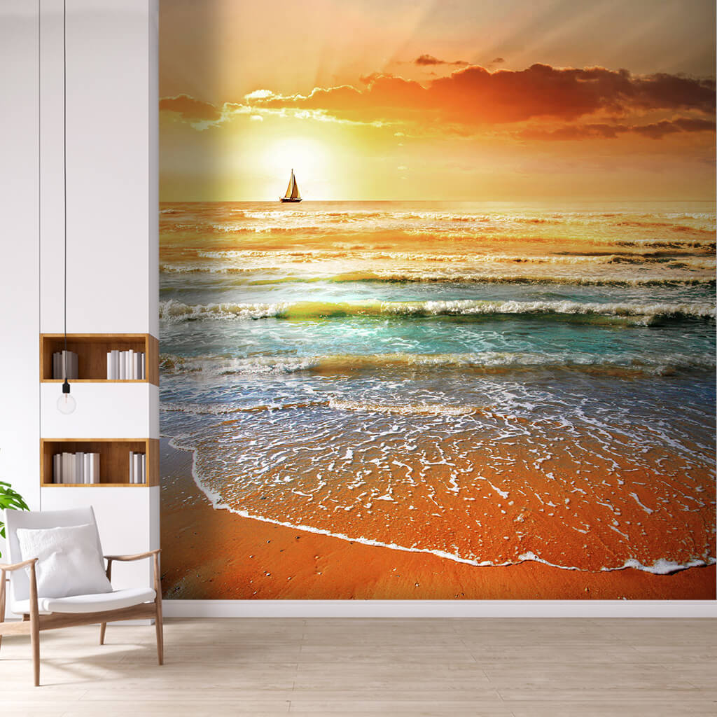 Sunset at sea and sailboat from the beach scalable wall mural