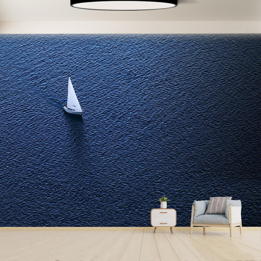 View from the sky white sailboat alone in ocean wall mural