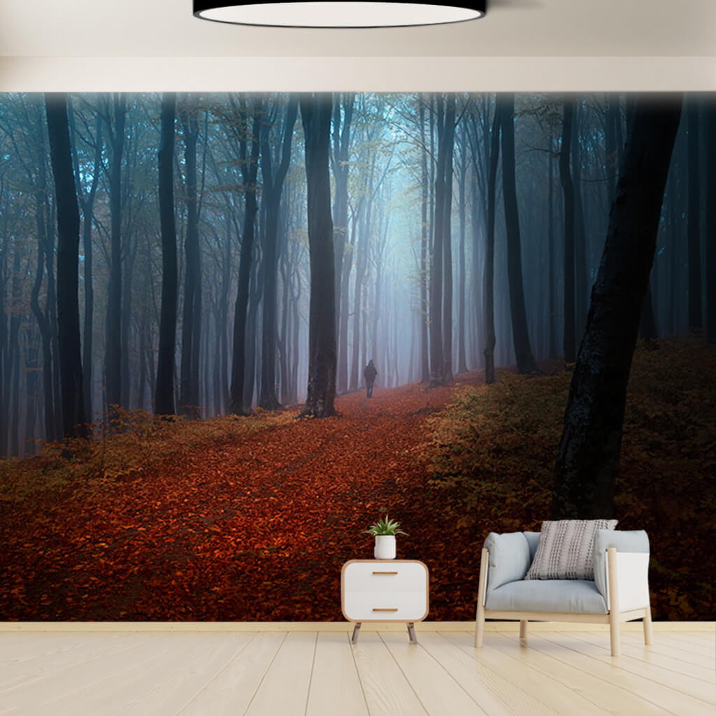 Lonely man on the road in foggy forest autumn wall mural